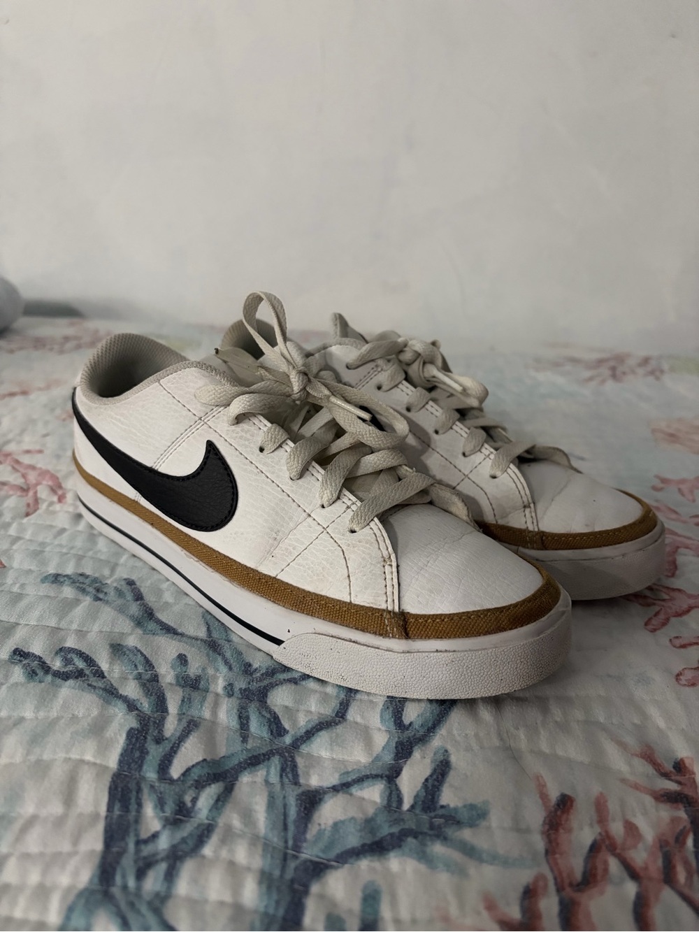 Nike White Sneakers with Black Swoosh and Brown Accent